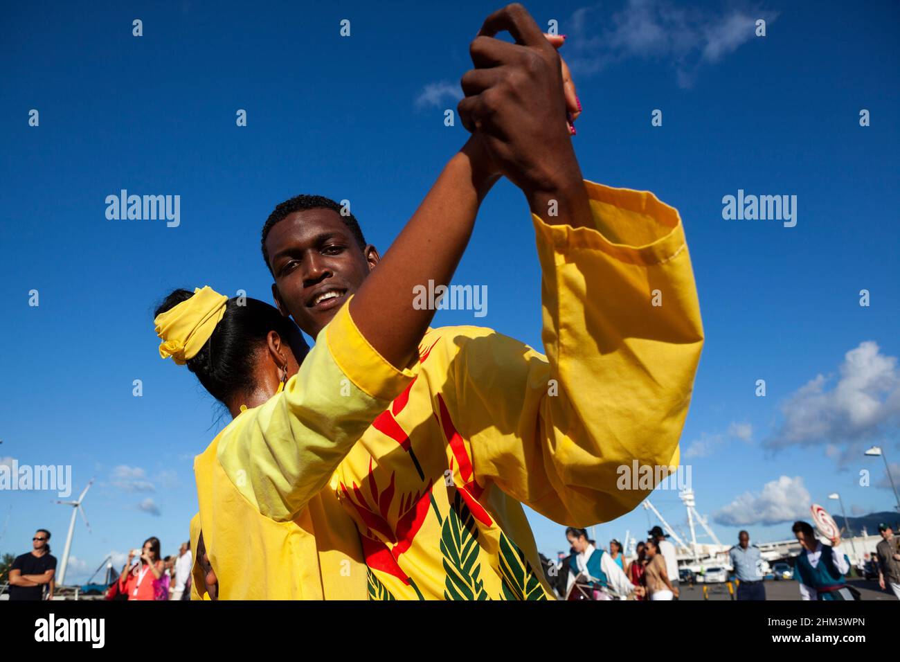 A couple dancing in the streets of Victoria during carnival in the Seychelles. Stock Photo