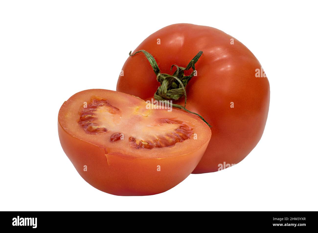 Image of ripe vegetables whole and half red tomato Stock Photo