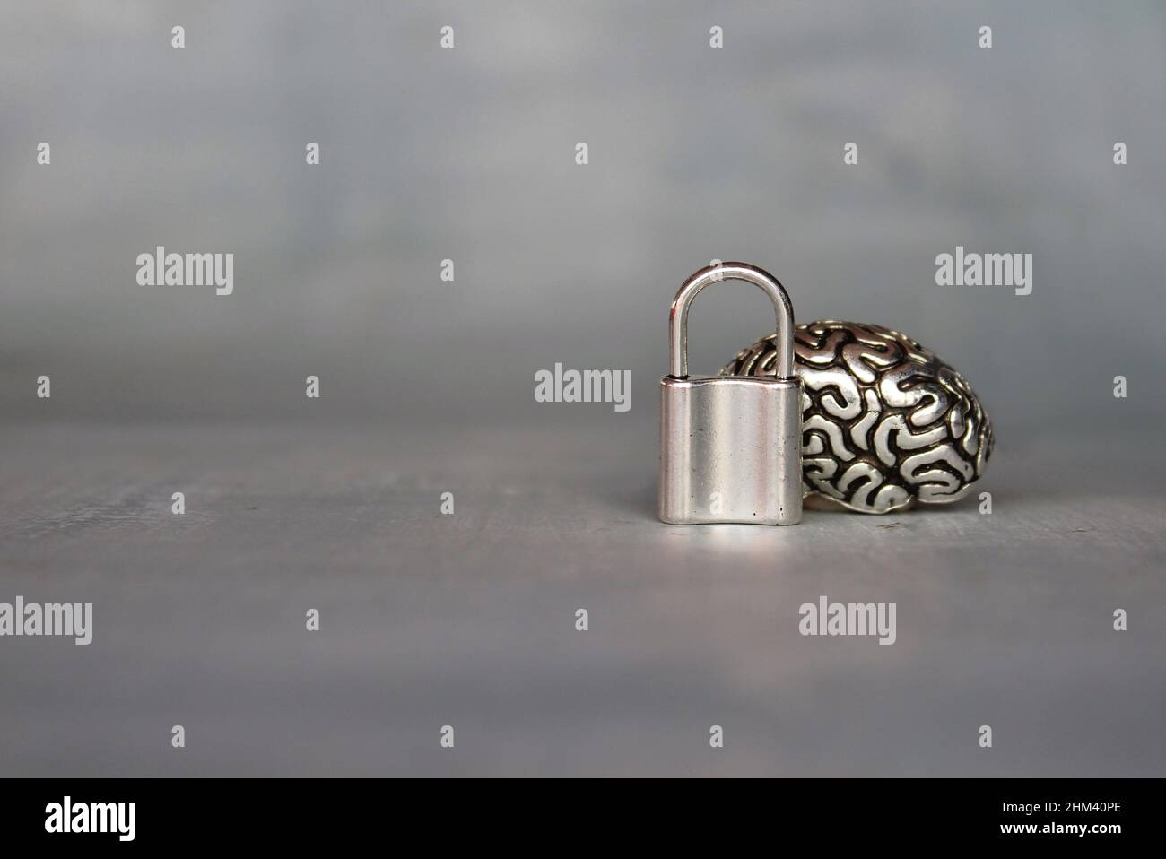 Brain model with a padlock. Copy space for text. Unlocking the brain's full potential concept. Stock Photo