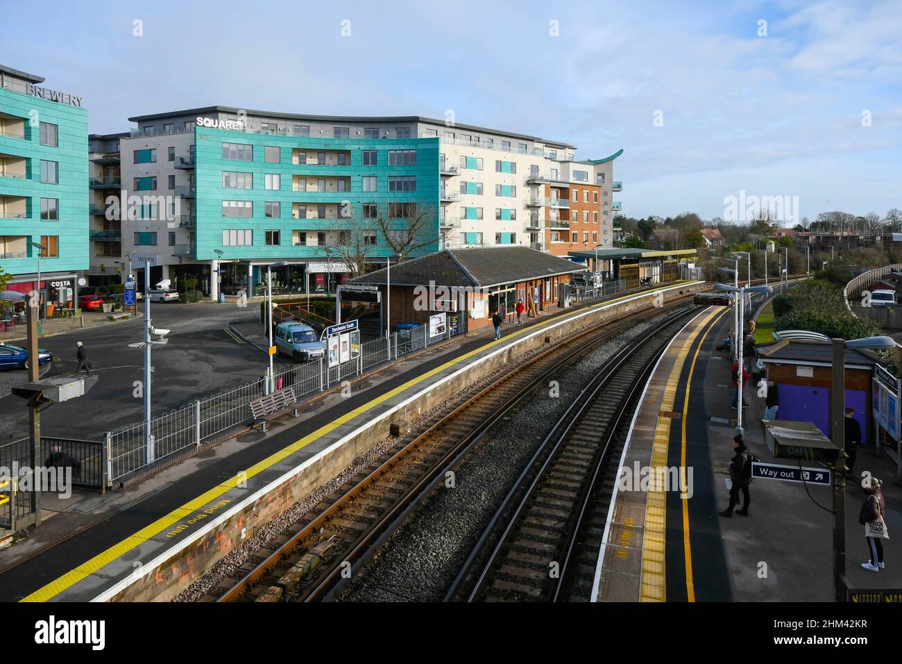 Dorchester, Dorset, UK.  7th February 2022.  UK Weather.  General view of Dorchester South railway station in Dorset with a view of the Brewery Square development on a morning of warm hazy sunshine.  Picture Credit: Graham Hunt/Alamy Live News Stock Photo