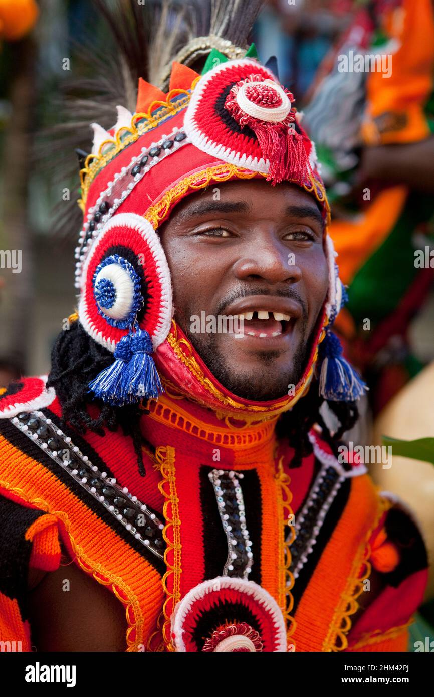 Street performer in traditional attire during carnival in the Seychelles. Stock Photo
