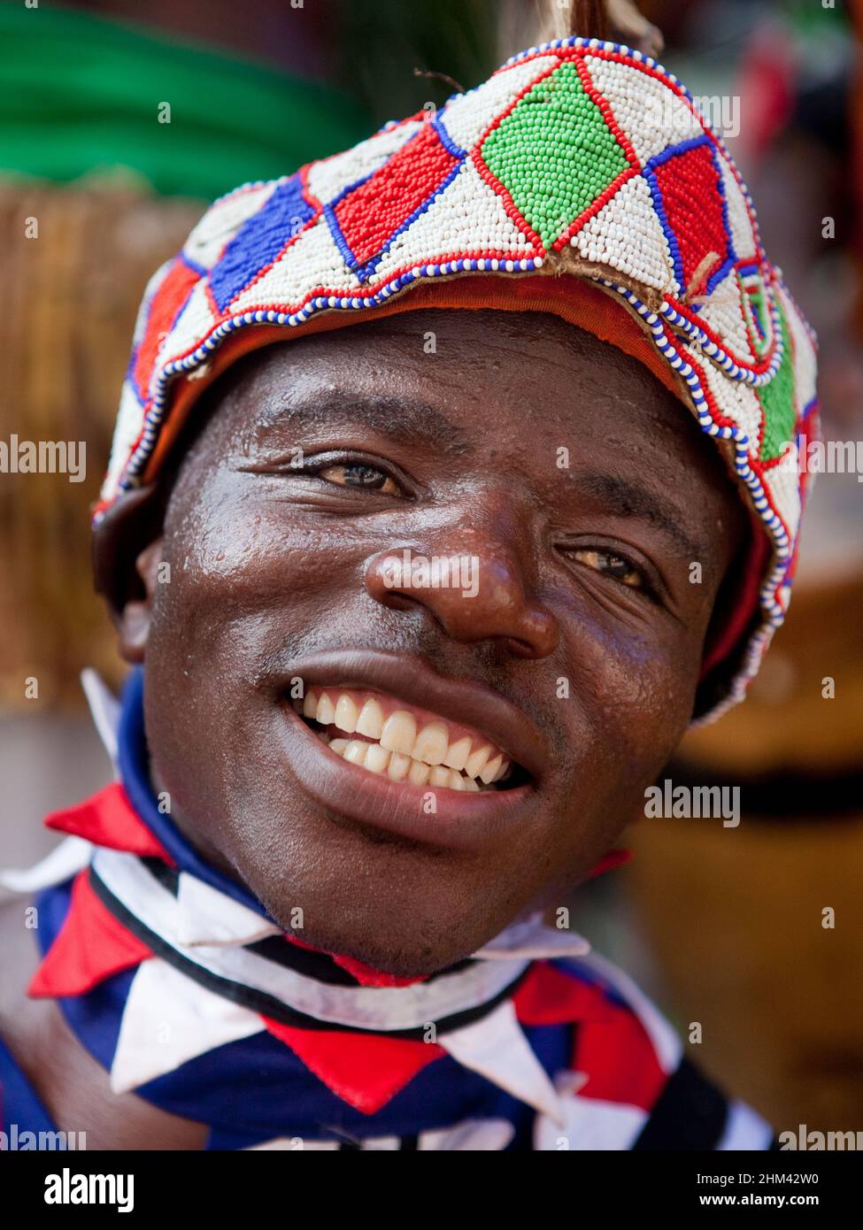 Street performer in traditional attire during carnival in the Seychelles. Stock Photo