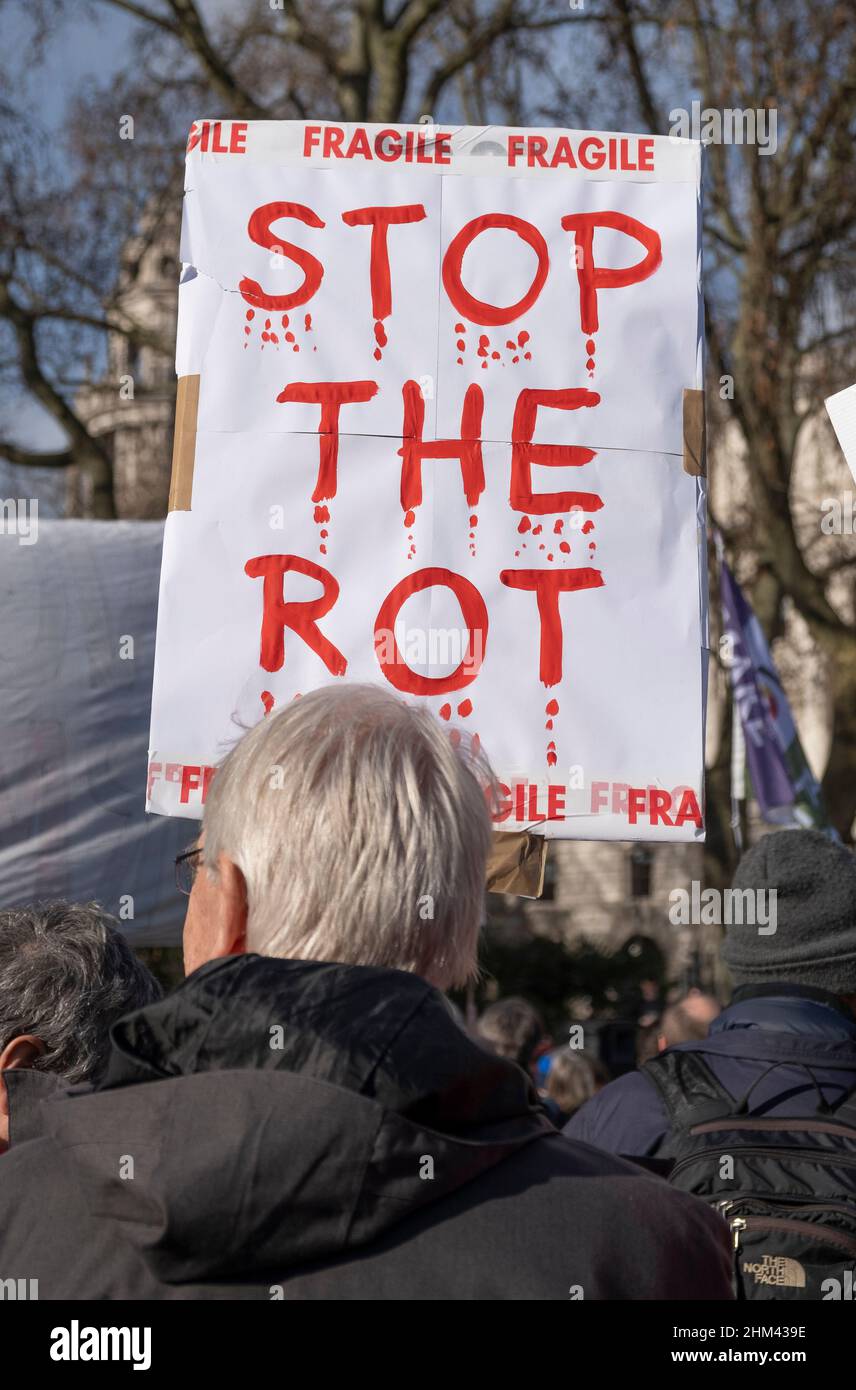 London, UK, 5th February 2022. Protester holding signs at the Make Votes Matter rally, in protest of the Tory government's unfair Elections Bill. The Make Votes Matter movement wants to introduce Proportional Representation to the Houses of Commons in Westminster. Stock Photo