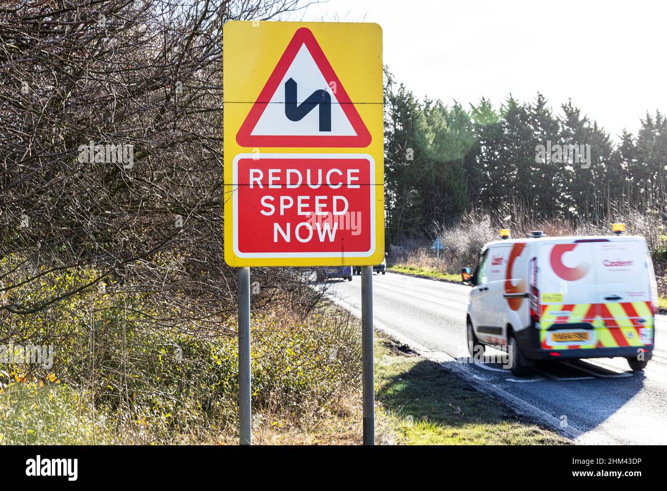 Reduce speed now sign, reduce speed now road sign, road sign, road