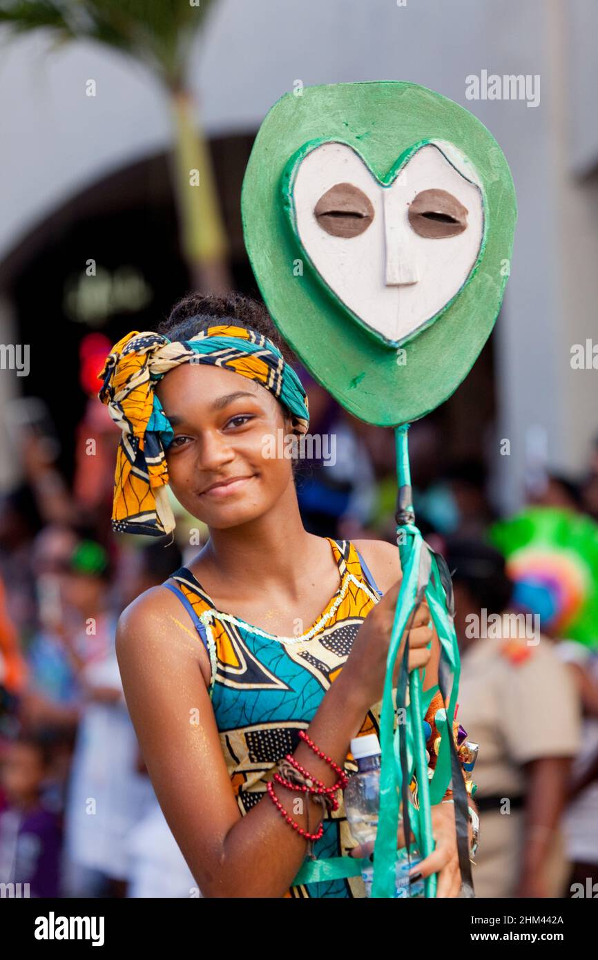 Young woman marching during a street parade at Carnival in the Seychelles. Stock Photo