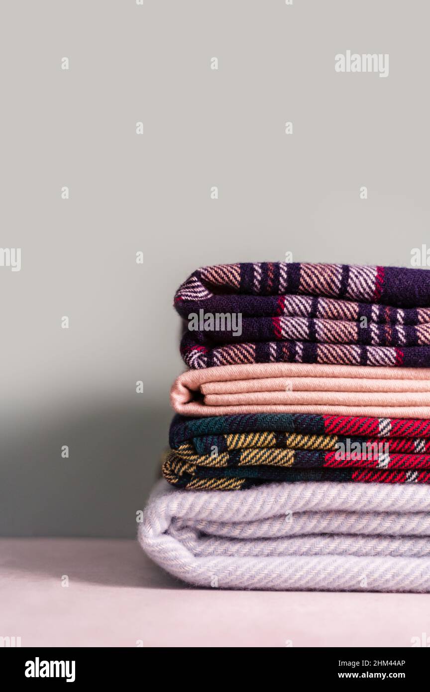 Stack of woolen checked blankets Stock Photo