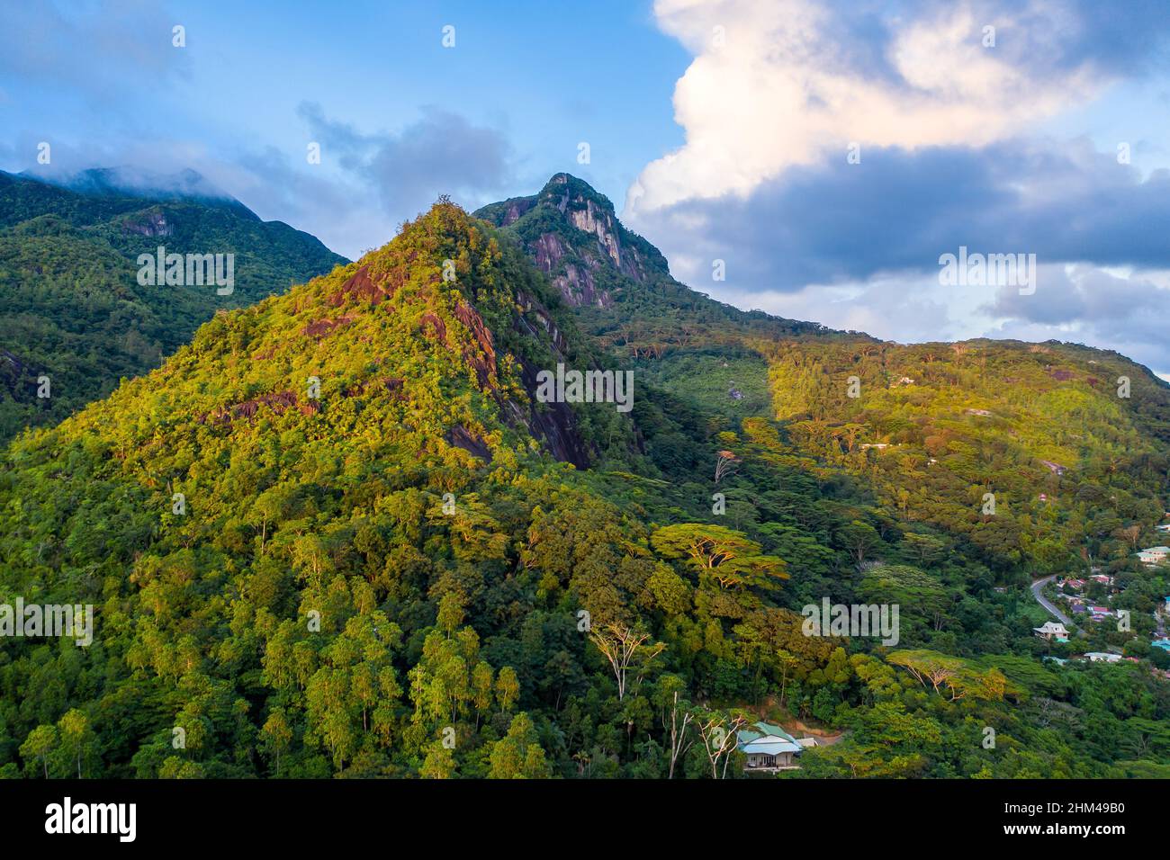 Morne Seychellois National Park aerial view from drone during sunset, golden hour, with lush tropical mountains, Mahe Island, Seychelles. Stock Photo