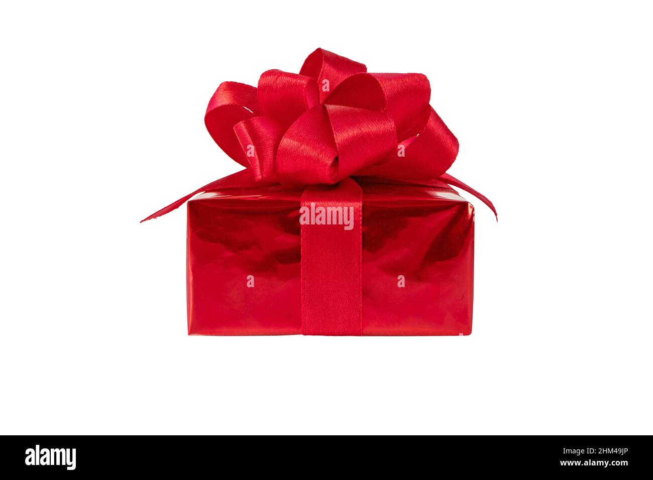 Red gift box with satin ribbon bow side view isolated on white