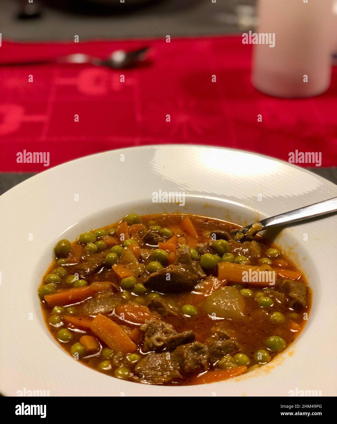 French biff stew. Rustic meat stew with carrot and green peas Stock Photo