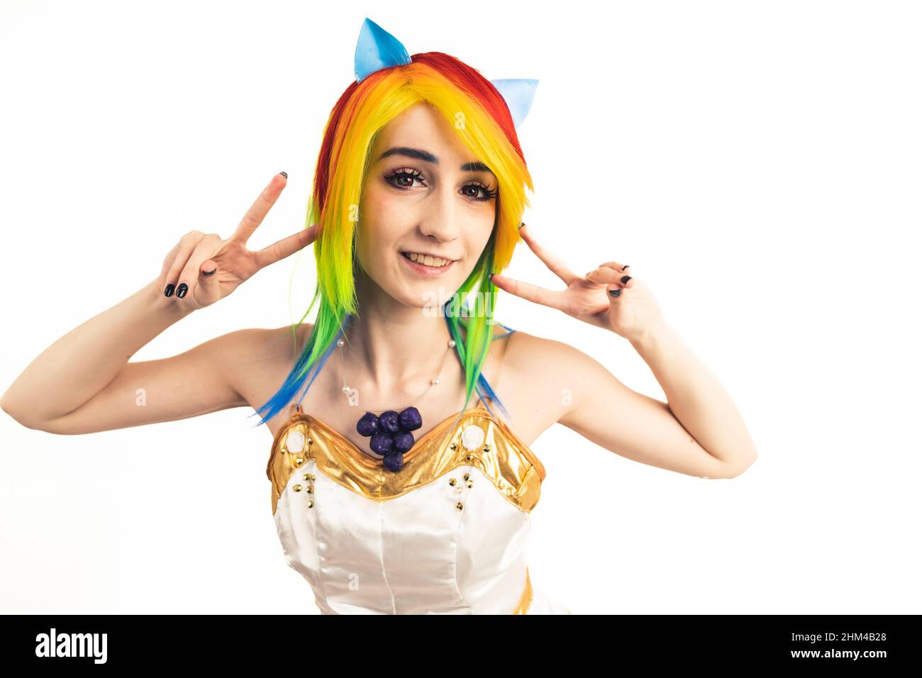 Woman wearing Rainbow Dash Cosplay Costume medium close-up studio shot. High quality photo Stock Photo