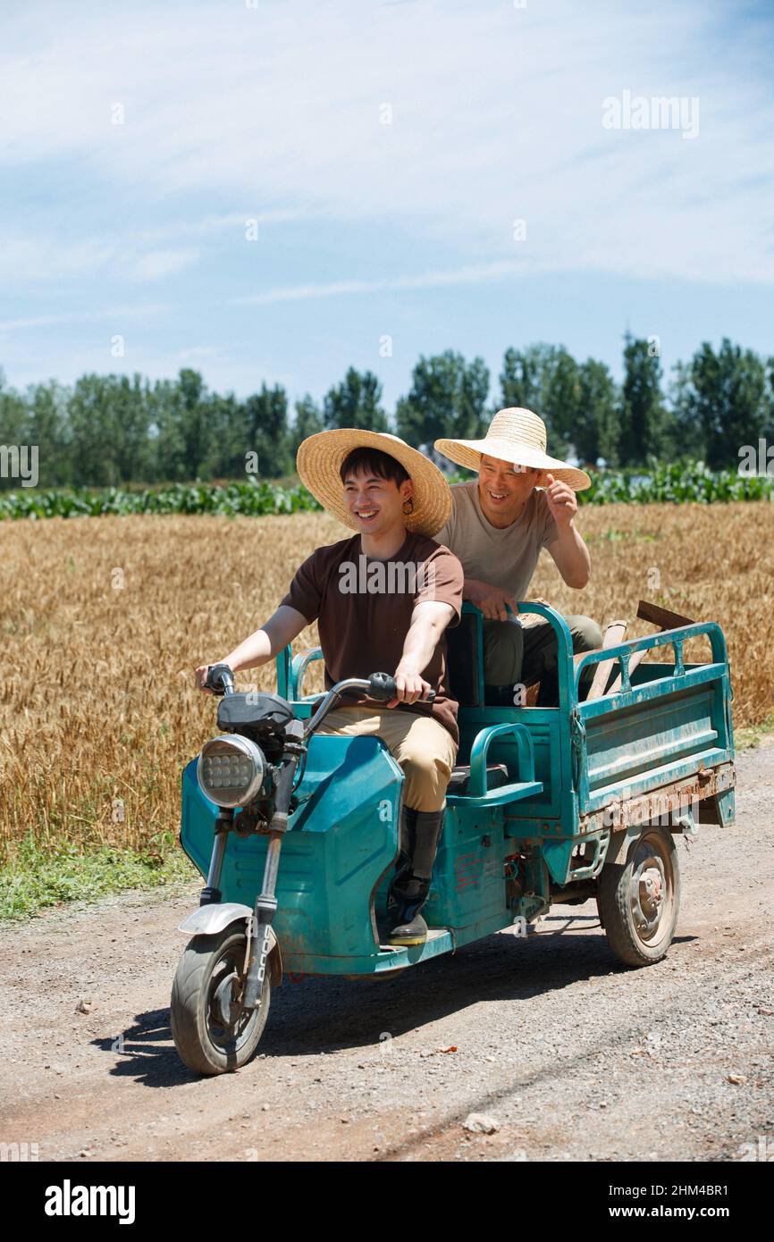 Driving tricycle farmers Stock Photo Alamy