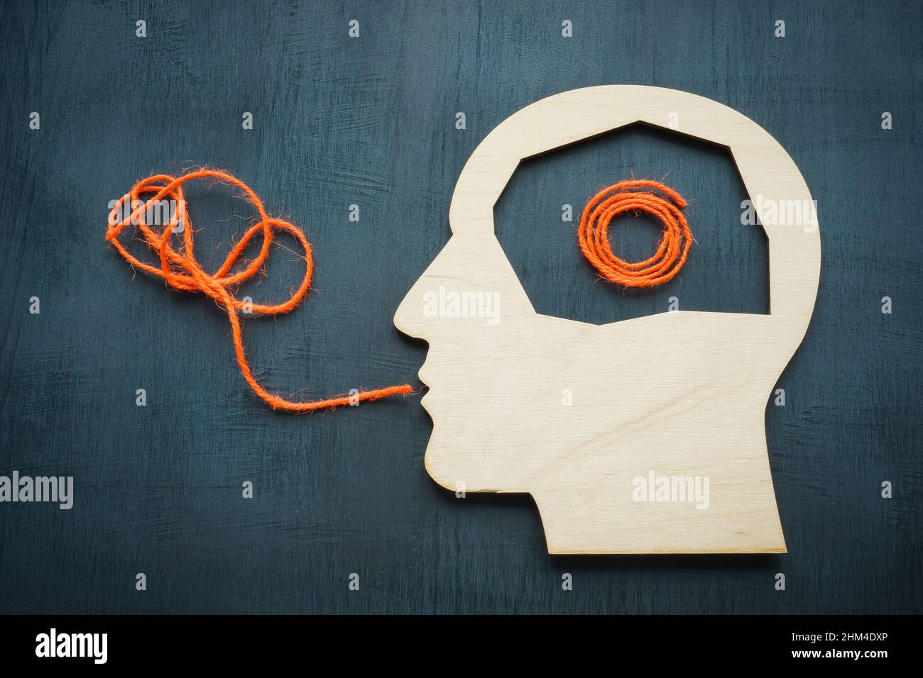 Head shape and rope. Problem with oral communication concept. Stock Photo