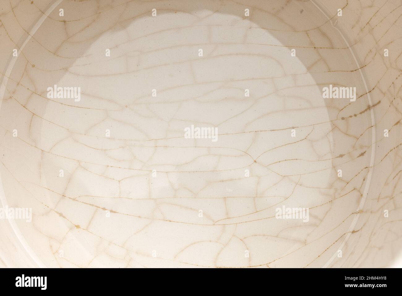 cracked glaze on the bottom of a white ceramic cup Stock Photo Alamy