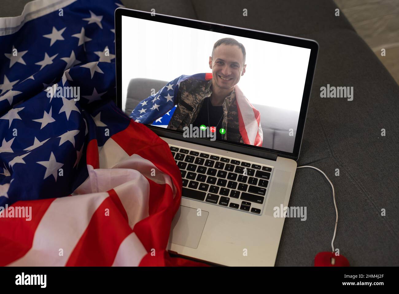 Mature male soldier using laptop in headquarters building for ...