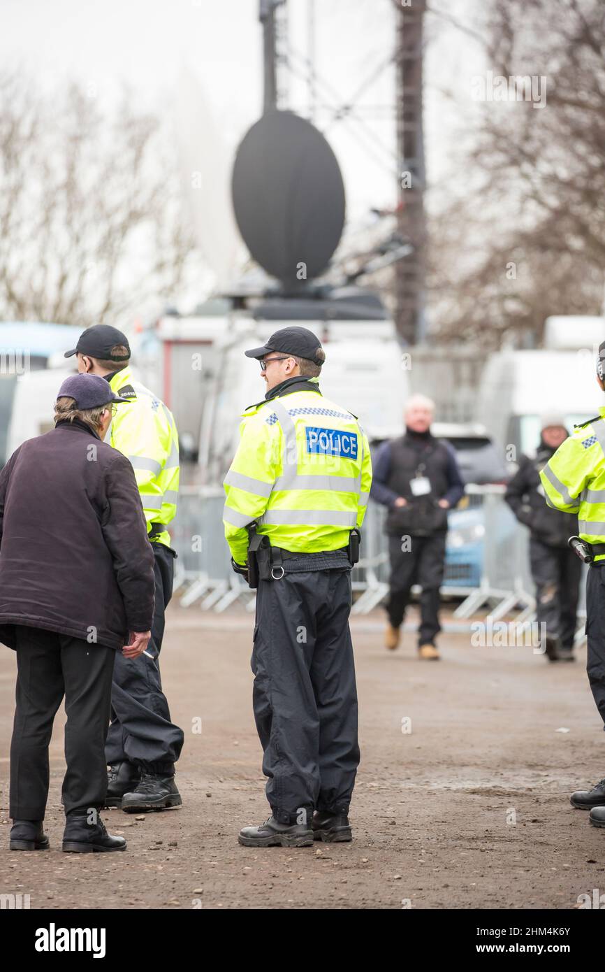 police officers and tv satellite truck Stock Photo