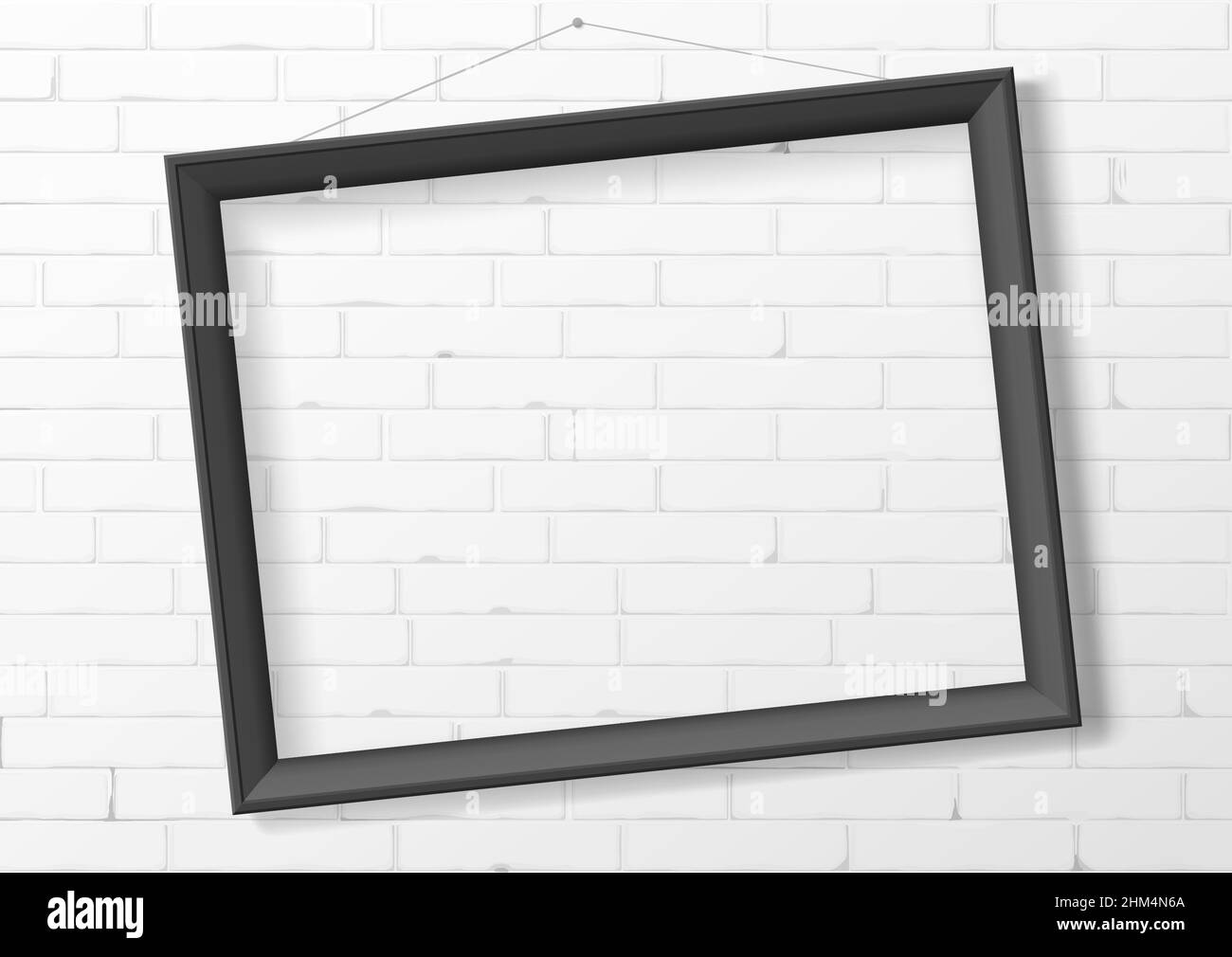 Horizontal black thin photo frame from wood on a brick wall. Frame