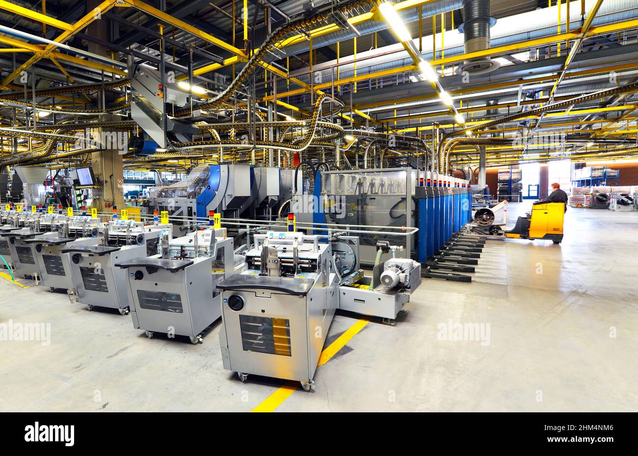 modern machines for transportation in a large print shop for production