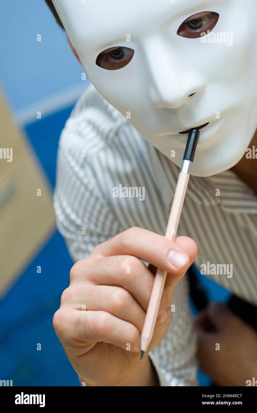 Close-Up Of A Person Wearing A Mask And Biting A Pencil, Credit:Photoshot Creative / Stuart Cox / Avalon Stock Photo