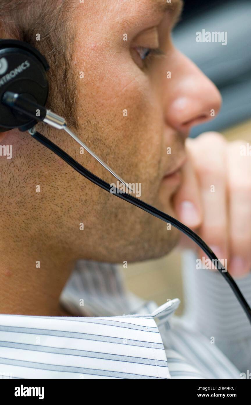 Close-Up Of A Mid Adult Man Wearing A Headset, Credit:Photoshot Creative / Stuart Cox / Avalon Stock Photo