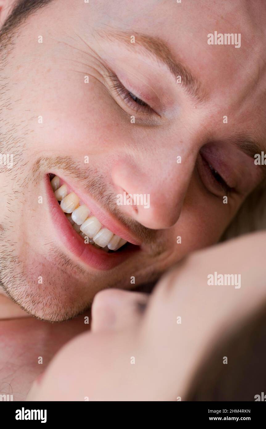 Close-Up Of A Young Man Smiling With A Young Woman, Credit:Photoshot Creative / Stuart Cox / Avalon Stock Photo