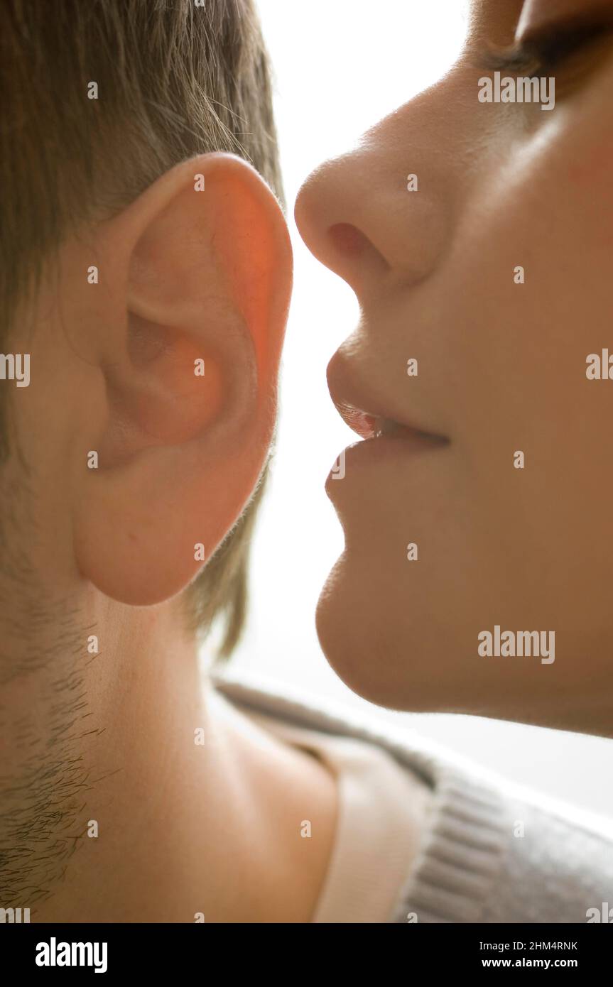 Close-Up Of A Young Woman Whispering In A Young Man'S Ear, Credit:Photoshot Creative / Stuart Cox / Avalon Stock Photo