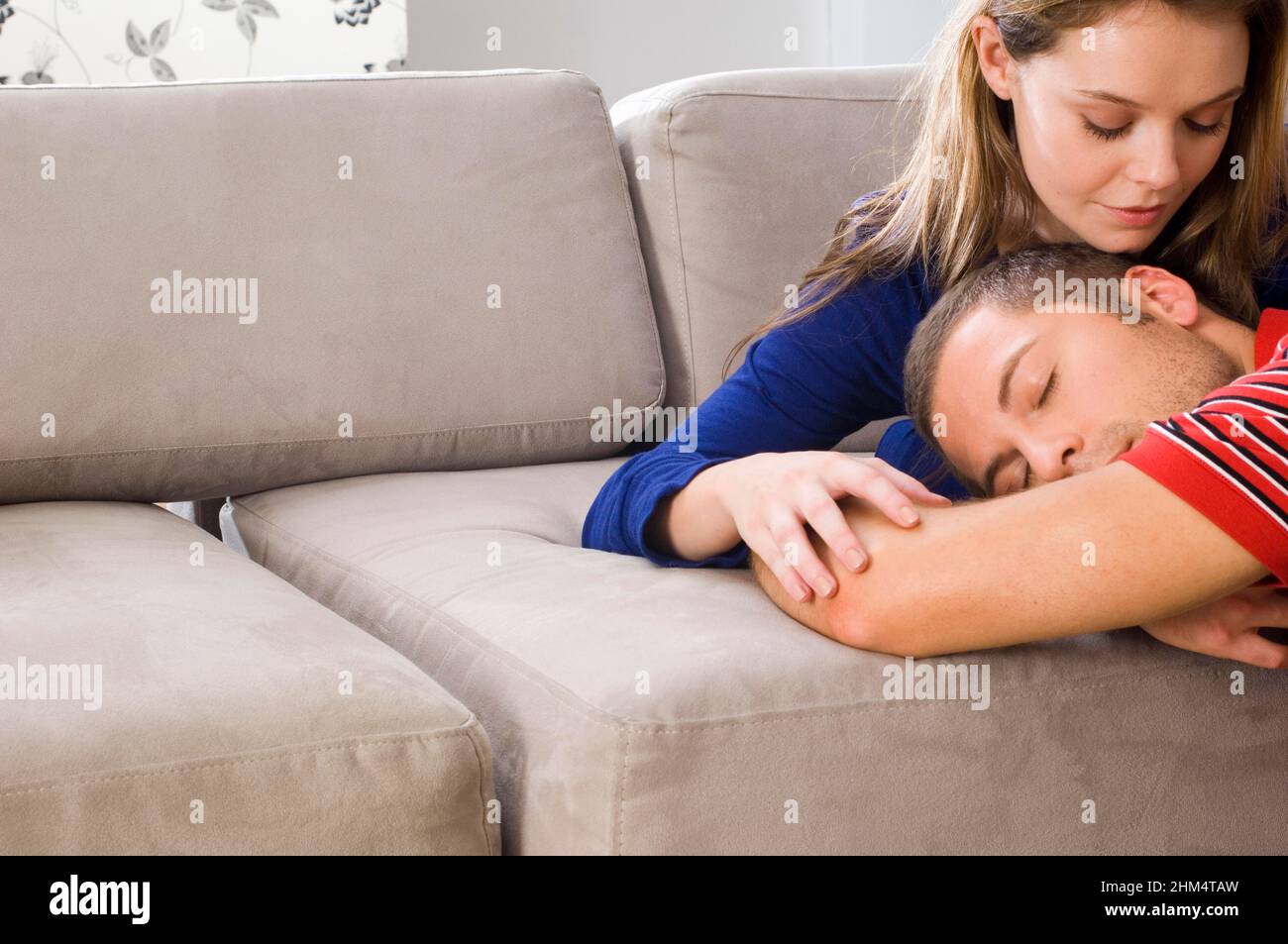 Close-Up Of A Young Couple Laying On A Couch, Credit:Photoshot Creative / Stuart Cox / Avalon Stock Photo