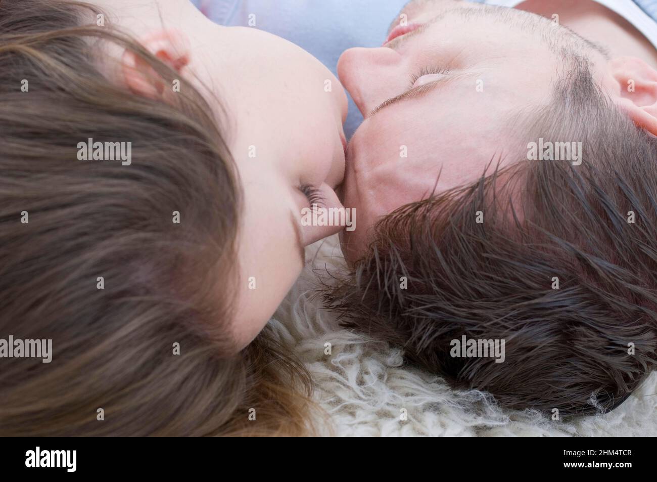 Close-Up Of A Young Couple Sleeping On A Rug, Credit:Photoshot Creative / Stuart Cox / Avalon Stock Photo