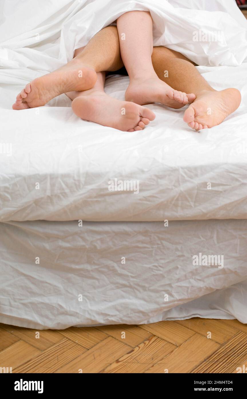 Low Section View Of A Man And A Woman Laying On The Bed, Credit:Photoshot Creative / Stuart Cox / Avalon Stock Photo