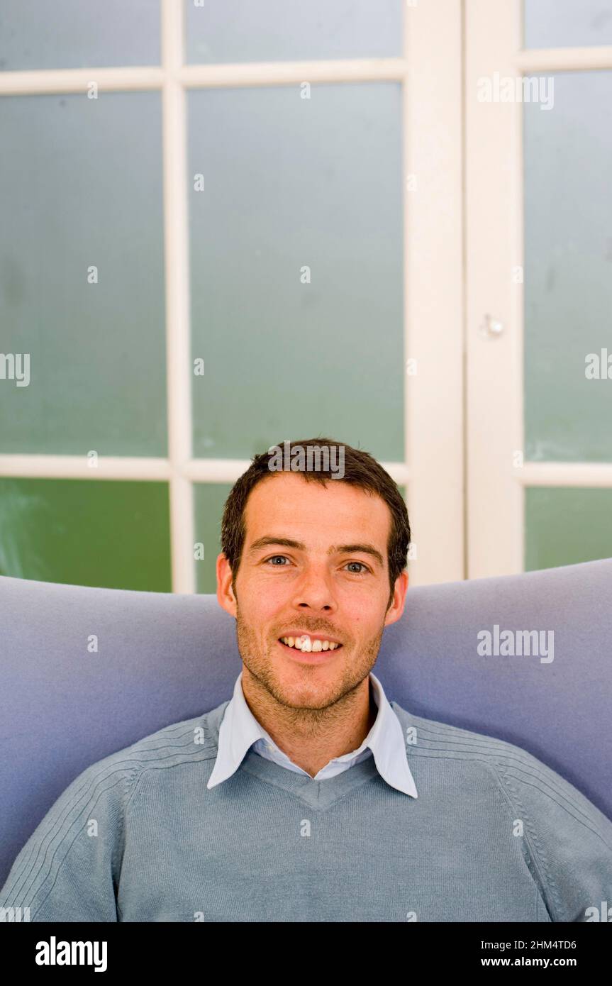 Portrait Of A Young Man Smiling, Credit:Photoshot Creative / Stuart Cox / Avalon Stock Photo