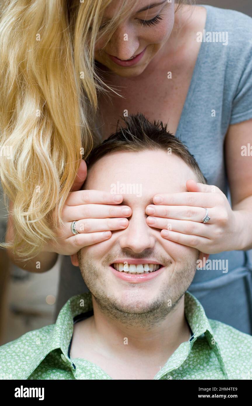 Close-Up Of A Young Woman Covering A Young Man'S Eyes, Credit:Photoshot Creative / Stuart Cox / Avalon Stock Photo