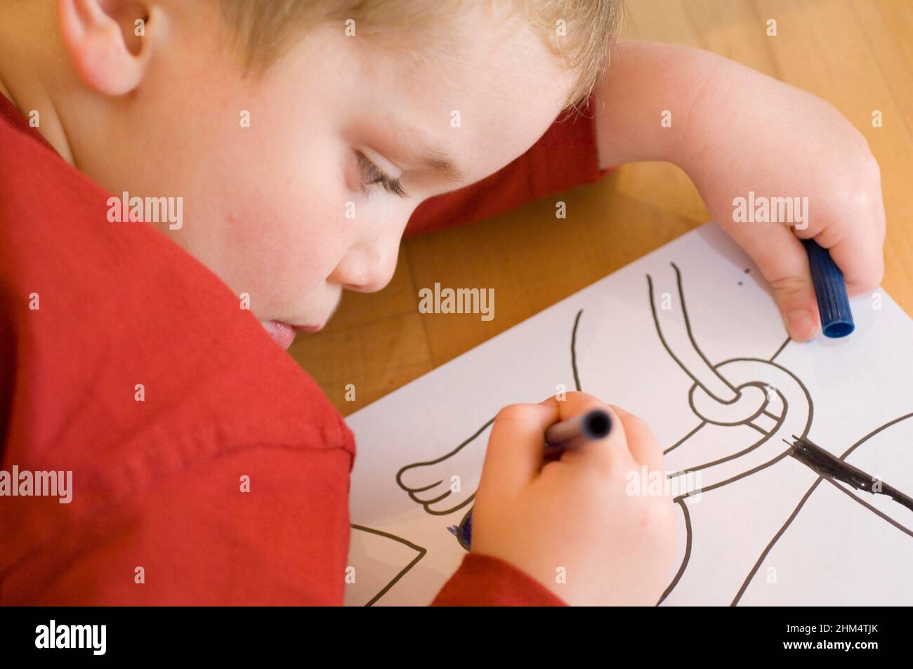 Close-Up Of A Boy Drawing On Paper, Credit:Photoshot Creative / Stuart Cox / Avalon Stock Photo