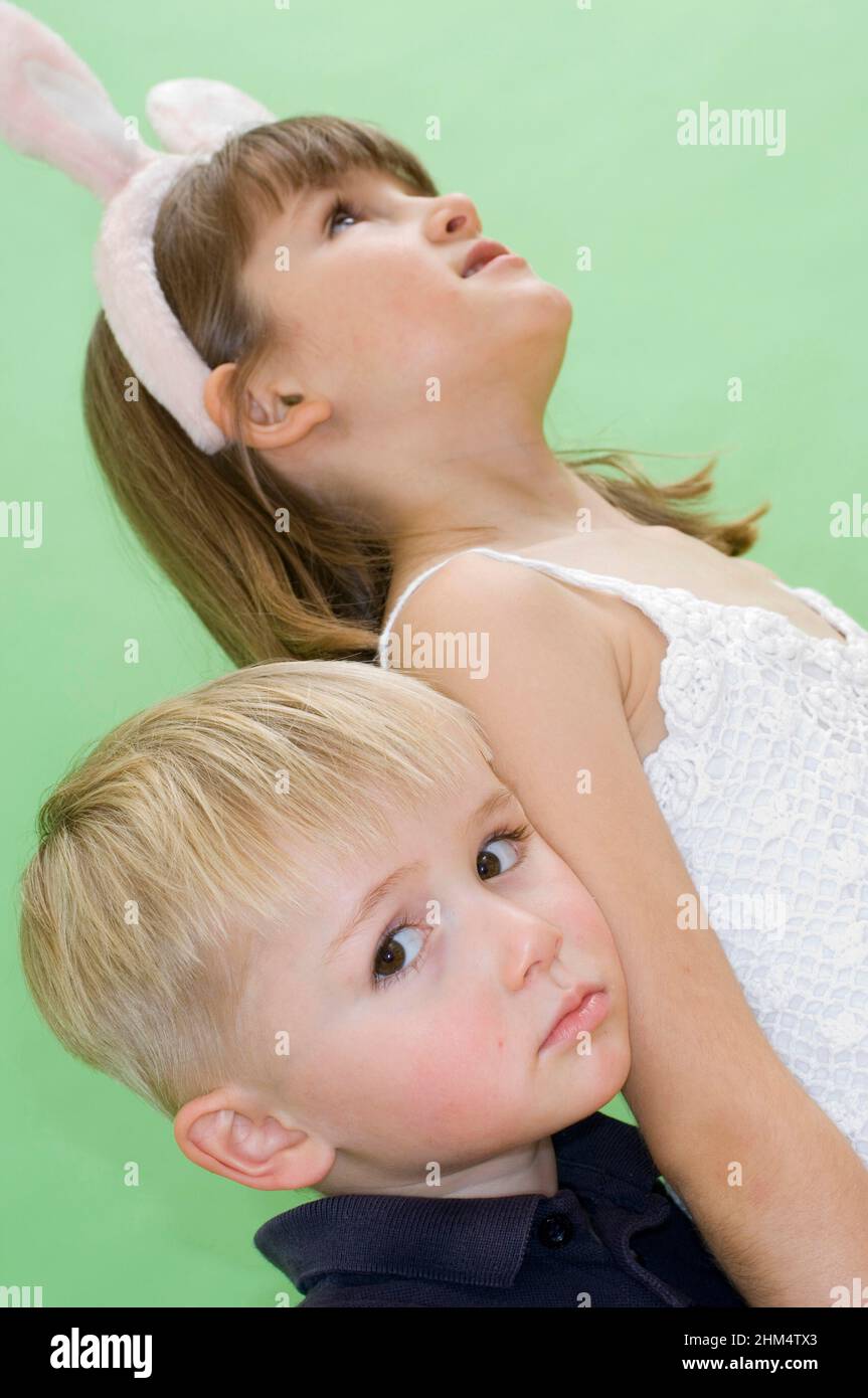 Low Angle View Of A Sister And Her Brother, Credit:Photoshot Creative / Stuart Cox / Avalon Stock Photo