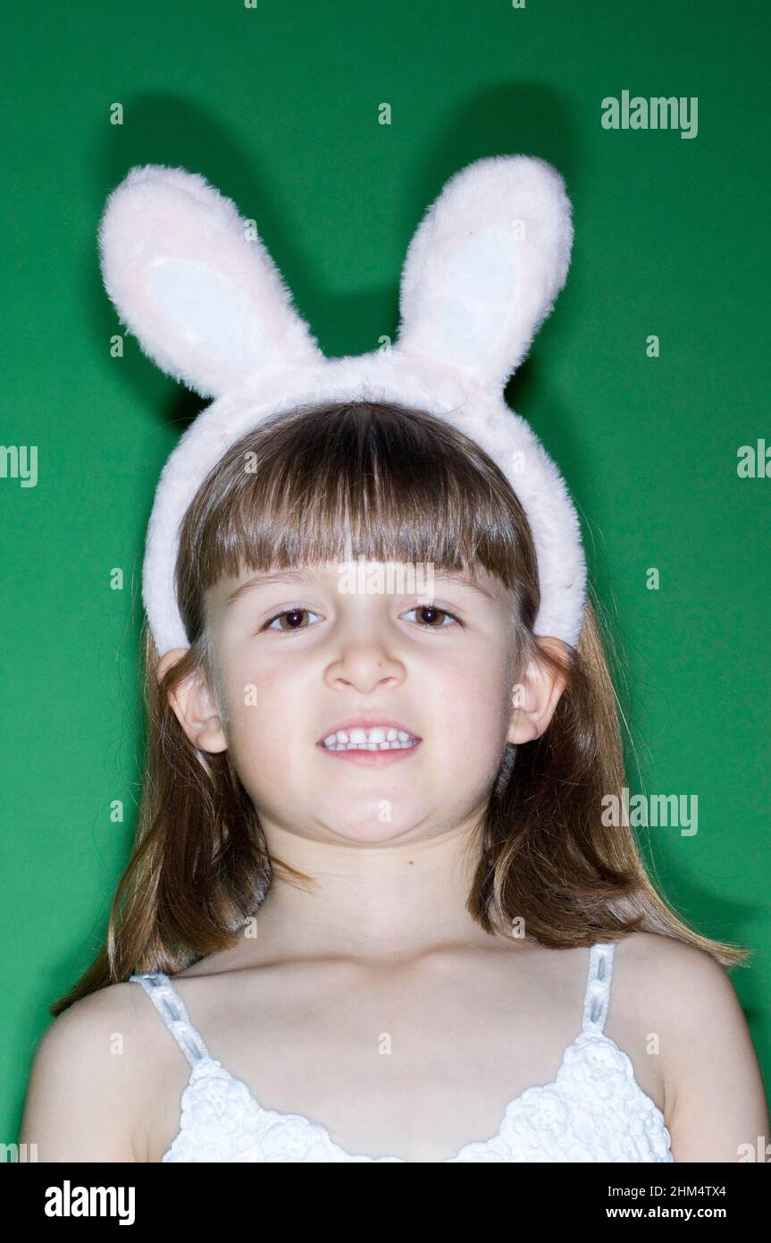 Portrait Of A Girl Wearing Rabbit Ears And Smiling, Credit:Photoshot Creative / Stuart Cox / Avalon Stock Photo