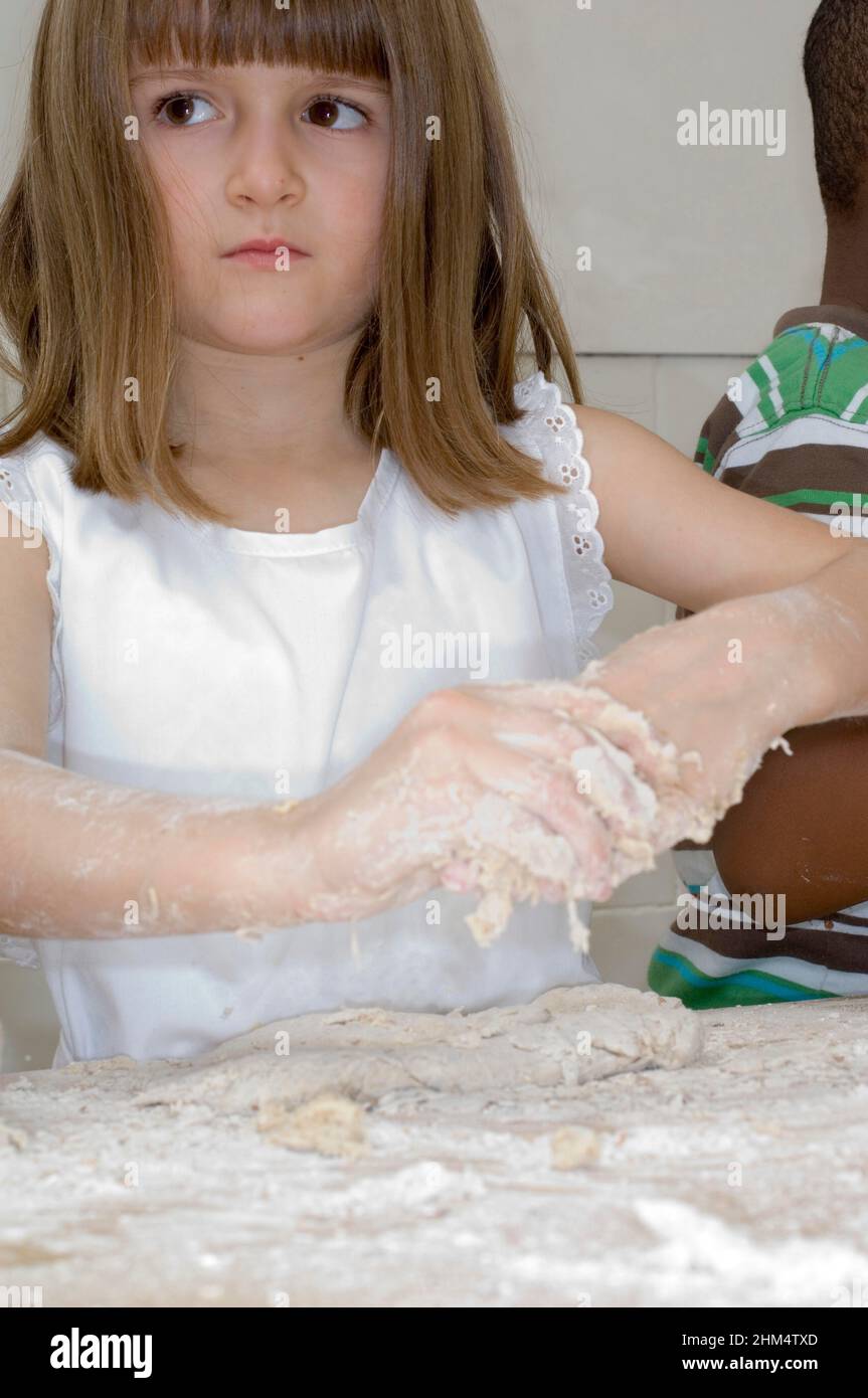 Close-Up Of A Girl Kneading Dough, Credit:Photoshot Creative / Stuart Cox / Avalon Stock Photo