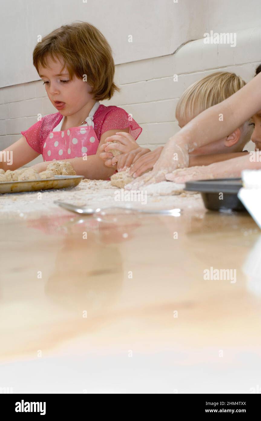 Children Kneading Dough, Credit:Photoshot Creative / Stuart Cox / Avalon Stock Photo