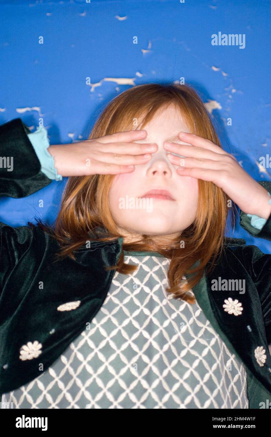 Little Girl Covering Eyes, Head Shot., Credit:Photoshot Creative / Stuart Cox / Avalon Stock Photo