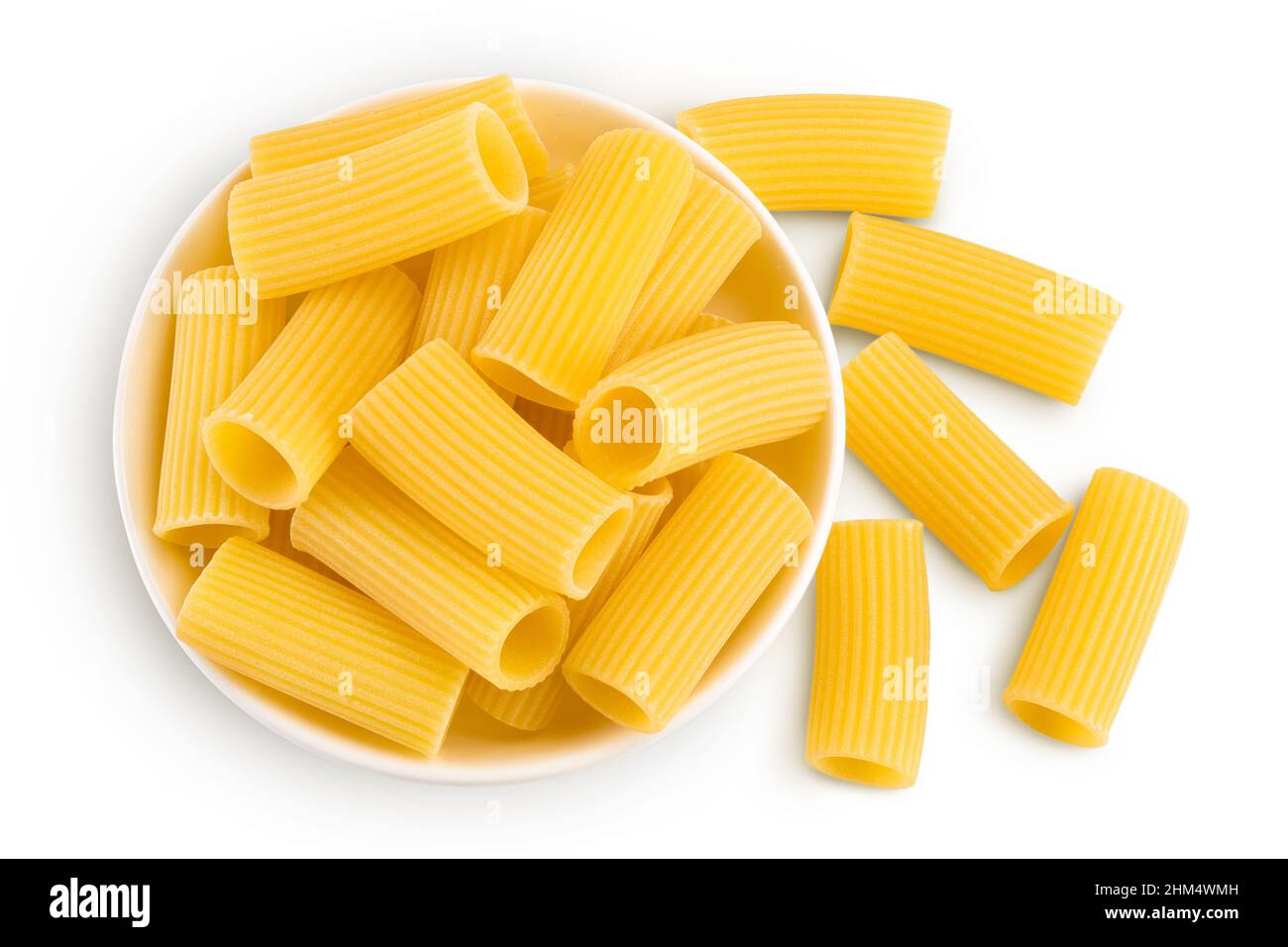 raw italian Rigatoni pasta in ceramic bowl isolated on white background ...