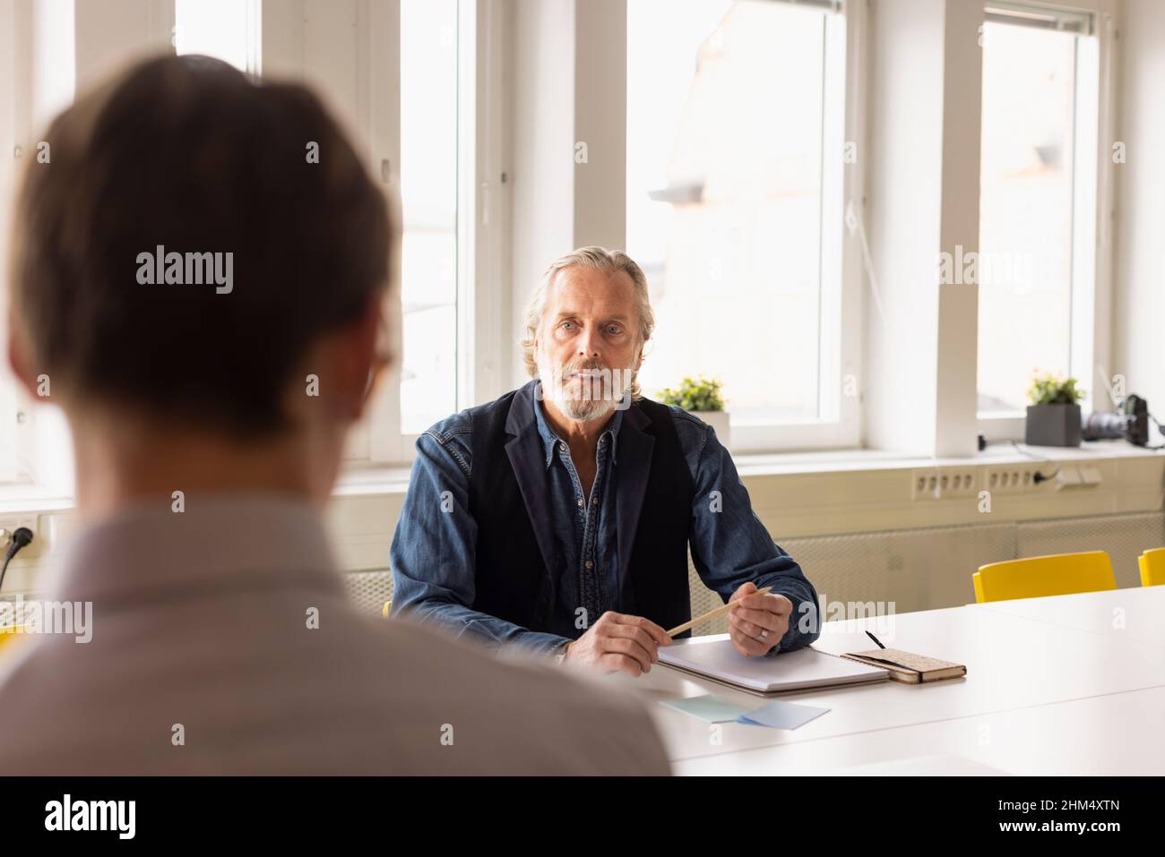Businessmen talking during meeting Stock Photo