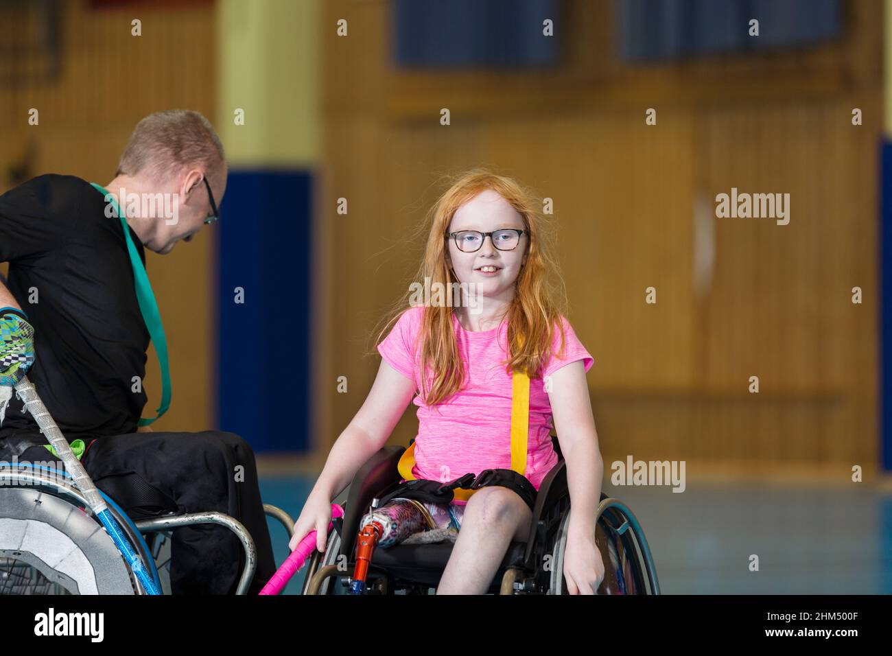 Disabled people playing in gym Stock Photo