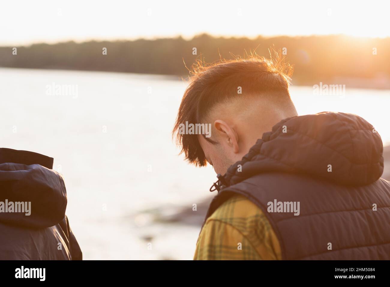 Man sitting at sea Stock Photo