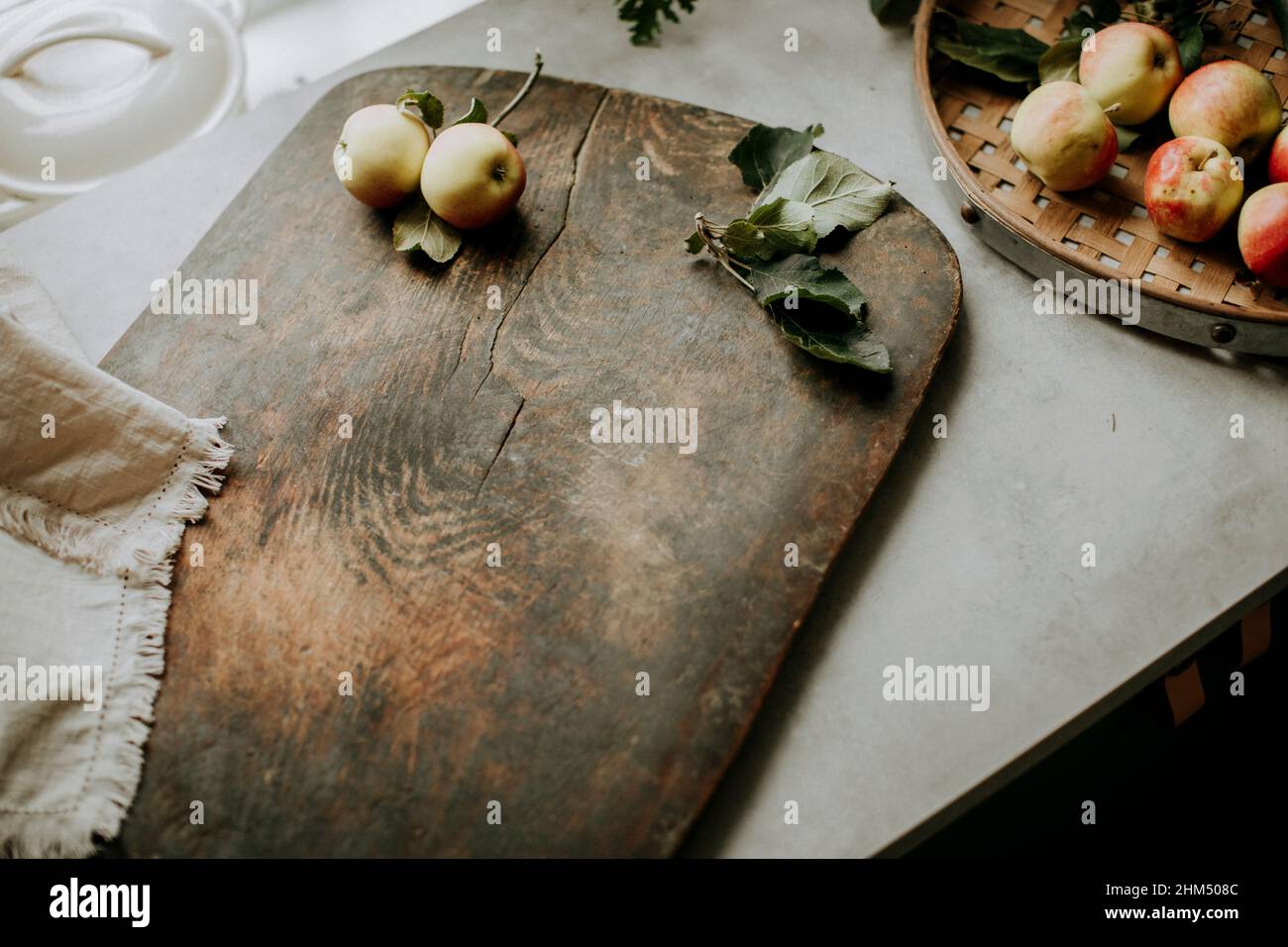 Wooden cutting board and apples Stock Photo