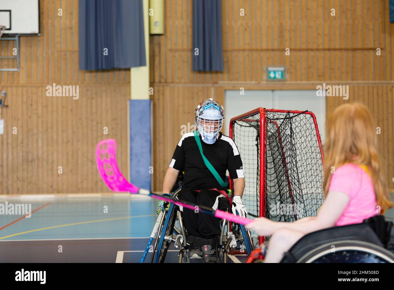 Disabled people playing in gym Stock Photo