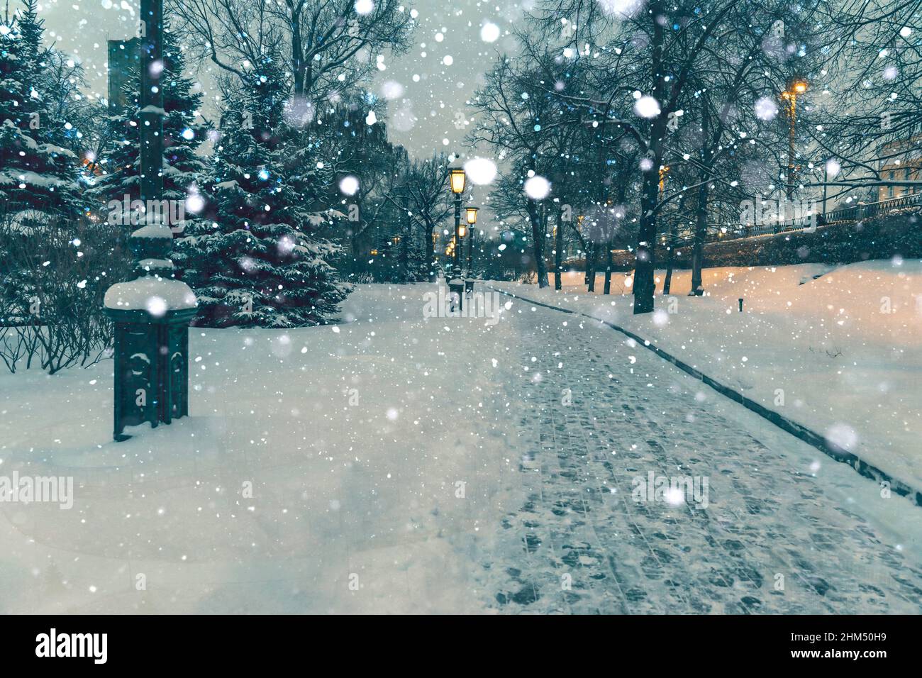 Falling snow illuminated by street lighting hi-res stock photography ...