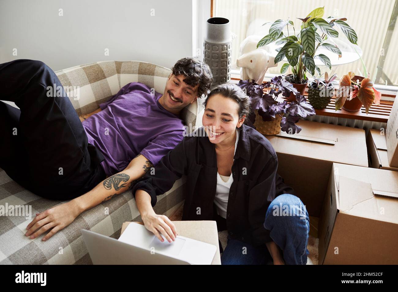 Young couple in living room Stock Photo