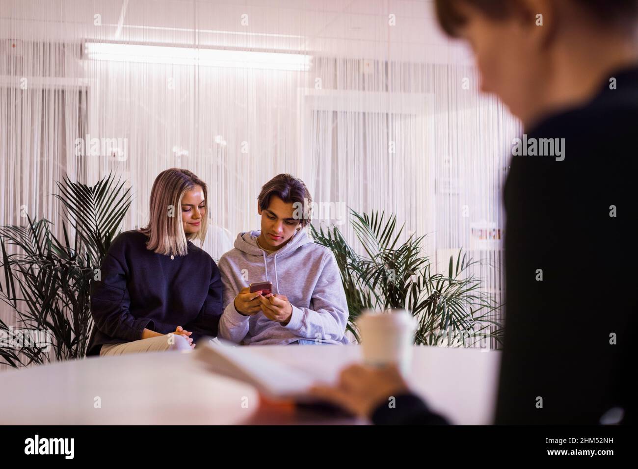 People sitting in waiting room Stock Photo