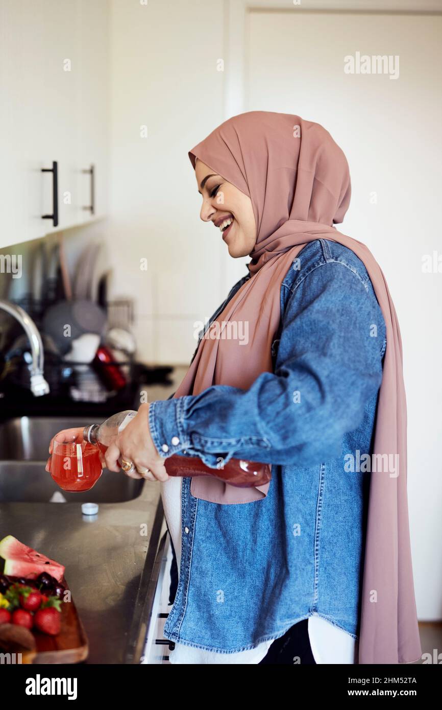 Happy woman hijab drinking hi-res stock photography and images - Alamy