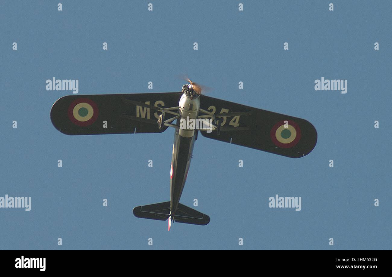 Morane-Saulnier monoplane of 1932 vintage and construction number 534 flying overhead against a blue sky Stock Photo