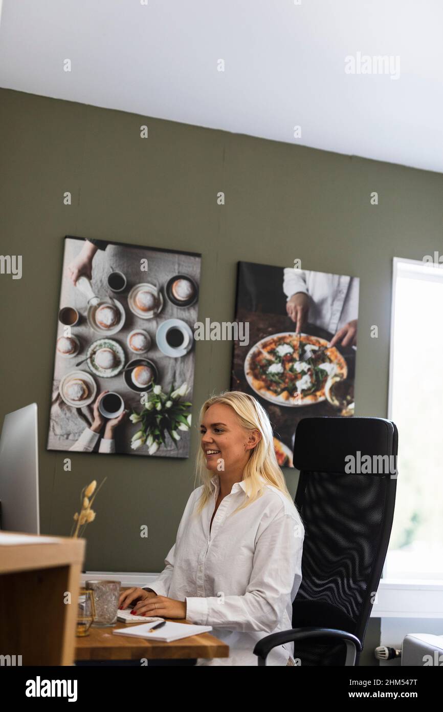 Woman using PC computer Stock Photo