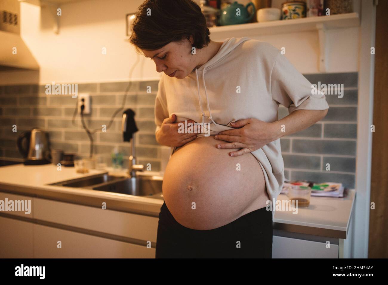 Pregnant belly hi-res stock photography and images - Alamy