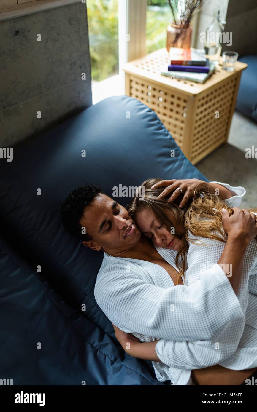 Couple hugging together Stock Photo - Alamy